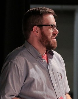 Charles Belt as The Handler