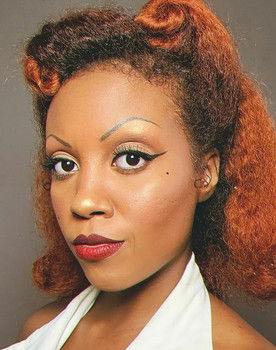 Miss Black Divine as Ana