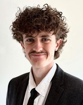 William Simmons as The Alpha Lad