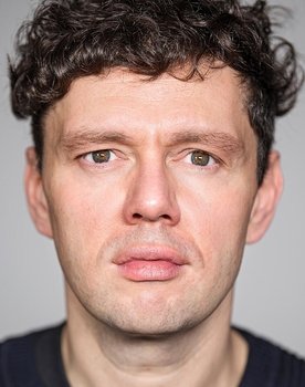 Christian Friedel as Dr. Wolfgang Teuter