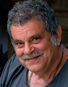 Kostas Gouzelis as Mini Market Owner