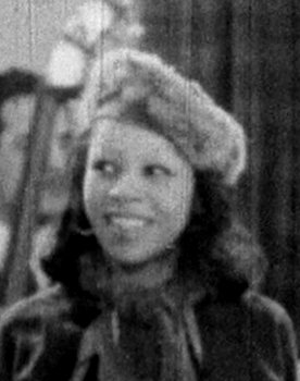 Doli Armenra as Miss Watkins, a Trumpet Player