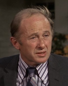 Milton Selzer as George Millordock, the Banker