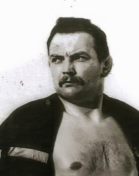 Roger Delaporte as Self - Wrestling Match on TV (uncredited)