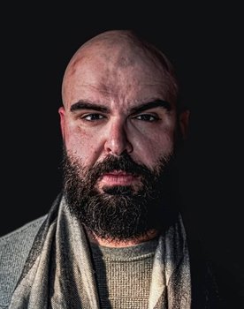 Andreas Georgiou as Coffee Shop Owner