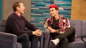 Image Joe Jonas Wears a Maroon and Gold Letterman Jacket With White Sneakers