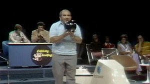 Still from Ed Asner and Gail Fisher vs. John Davidson ad Peggy Lennon