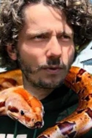 He lives and sleeps with alligators and 500 reptiles in France!