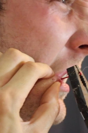 fish hook through the cheek