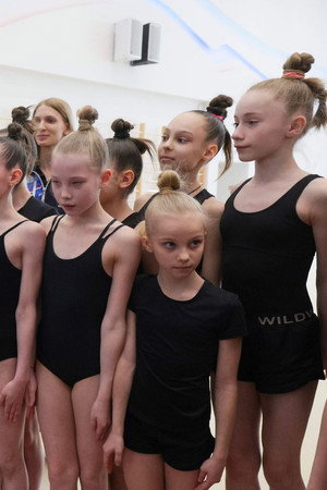 Why is Putin posing with children?