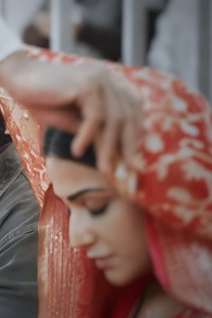 A priest blesses Sneha and Siddhu
