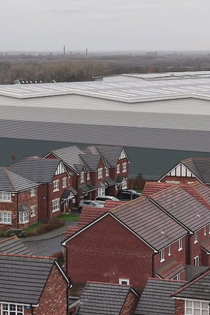 Giant warehouses built at the end of our gardens