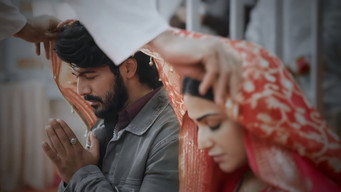 A priest blesses Sneha and Siddhu