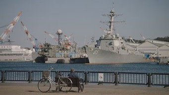 At a park in Yokosuka with a view of warships