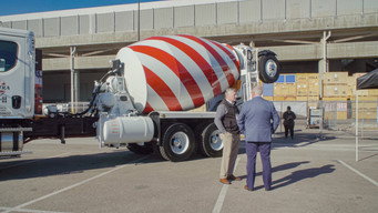 A quirky documentary scene featuring concrete textures and playful visuals, highlighting creativity and absurdity.