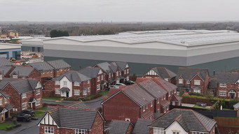 Giant warehouses built at the end of our gardens