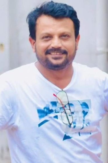 Professional headshot of Ashok Pati