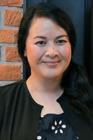 Professional headshot of Sita Nursanti