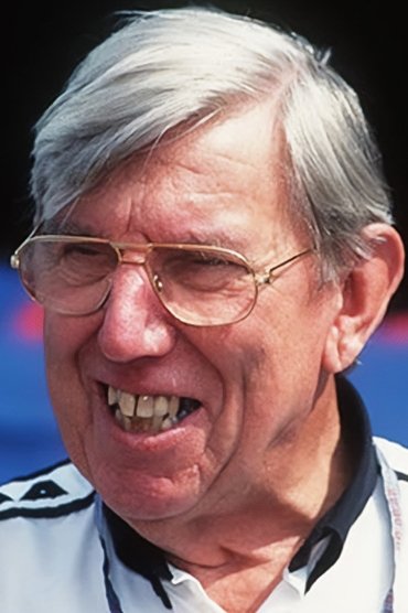 Professional headshot of Ken Tyrrell