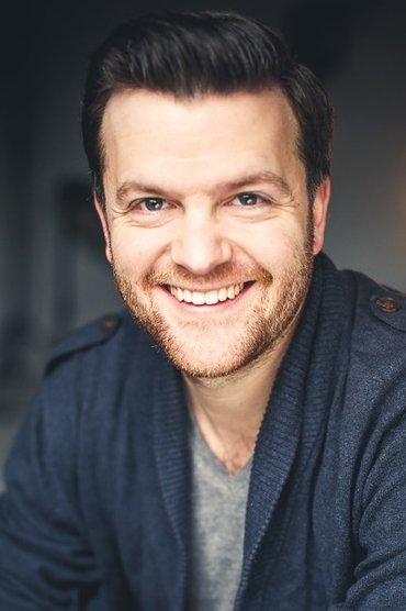 Professional headshot of Tom Bennett