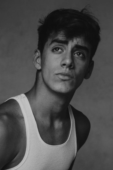 Professional headshot of Tomás Agüero