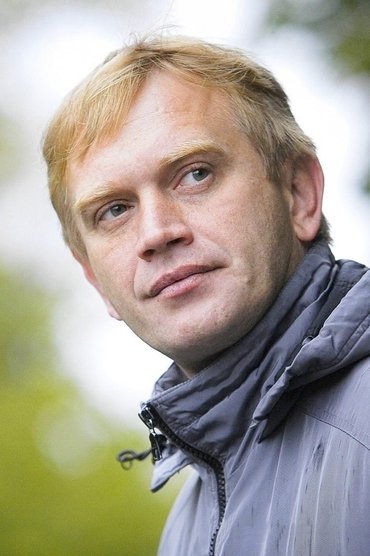 Professional headshot of Ain Prosa