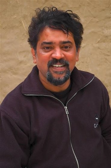 Professional headshot of Santosh Sivan