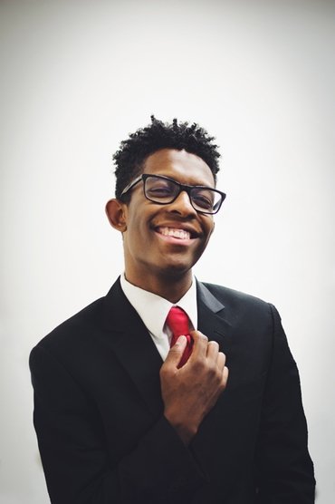 Professional headshot of BRELAND