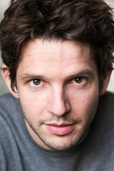 Professional headshot of Damien Molony