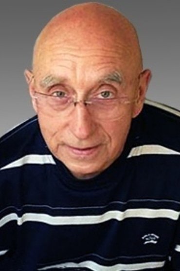 Professional headshot of Arkadiy Tigay
