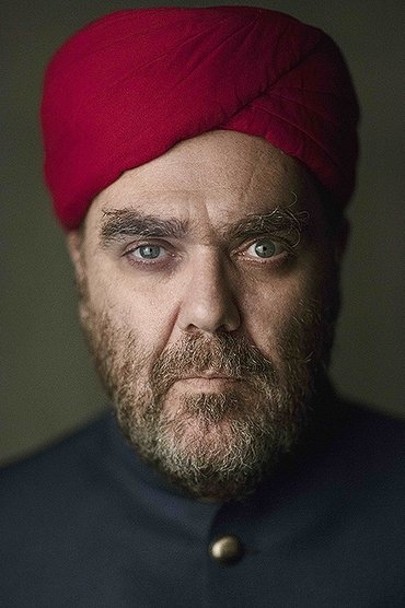 Professional headshot of André Abujamra
