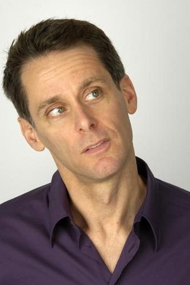 Professional headshot of Scott Capurro