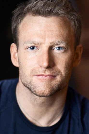 Professional headshot of Toby Levins