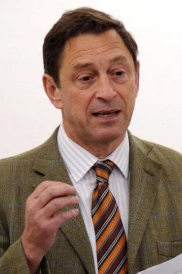 Professional headshot of Guy Standing