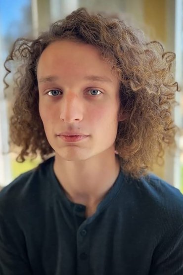 Professional headshot of Riley Thomas Stewart