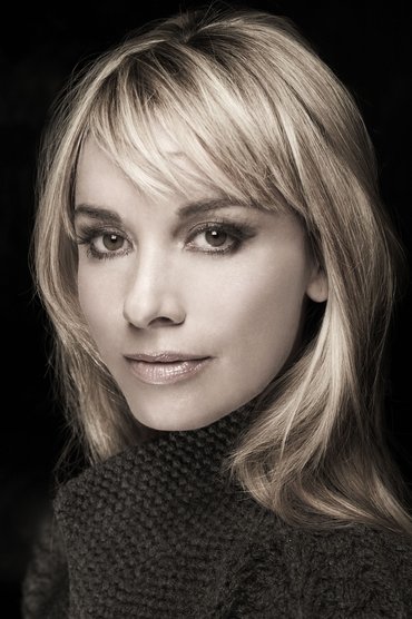 Professional headshot of Tamzin Outhwaite
