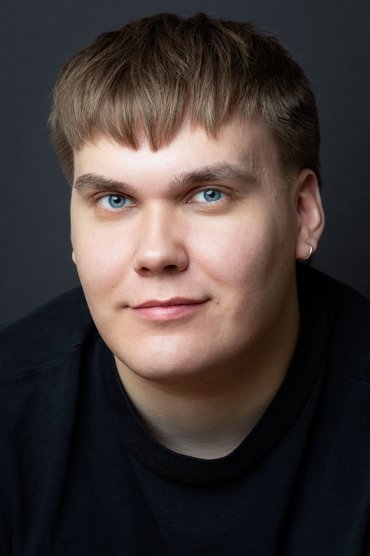 Professional headshot of Kasperi Kola