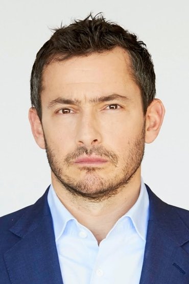 Professional headshot of Giles Coren