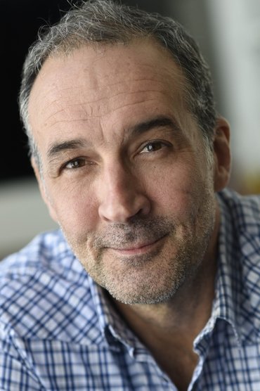 Professional headshot of Charley Tucker