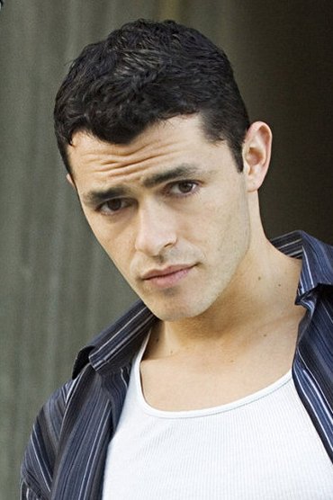 Professional headshot of Alex Luria