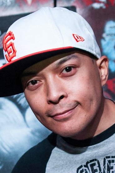 Professional headshot of DJ Q-Bert