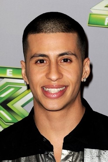 Professional headshot of Carlito Olivero