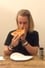 Macaulay Culkin Eating a Slice of Pizza photo