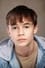 Jack Sherran as Young Robbie (voice) in Better Man