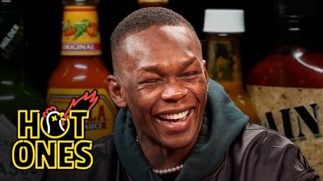 Israel Adesanya Gives Thanks While Eating Spicy Wings (2022) - Episode 9 poster and promotional image