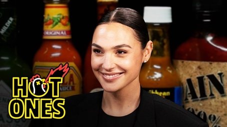 Gal Gadot Does a Spit Take While Eating Spicy Wings (2023) - Episode 13 poster and promotional image