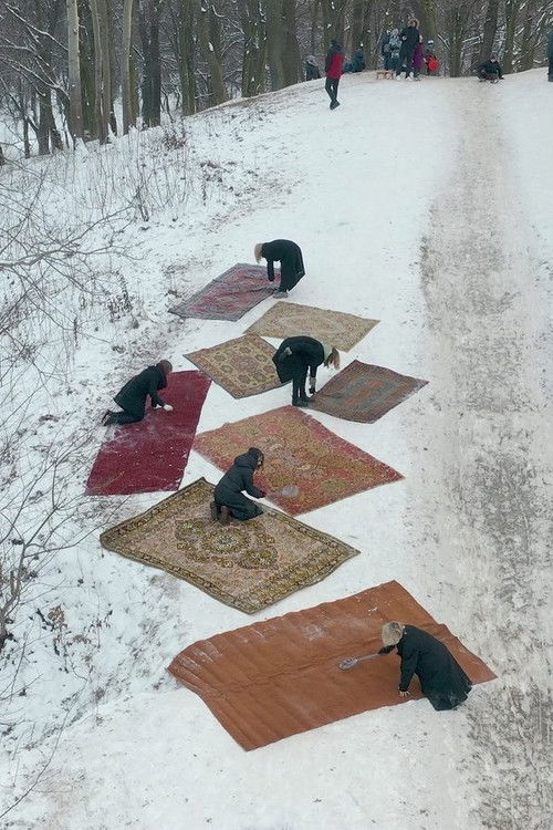 Women Knocking Out Carpets