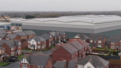 Giant warehouses built at the end of our gardens