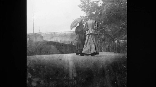 Promenaders by the Serpentine in Hyde Park still