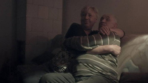 Couple in a Room Smoking Cigarettes